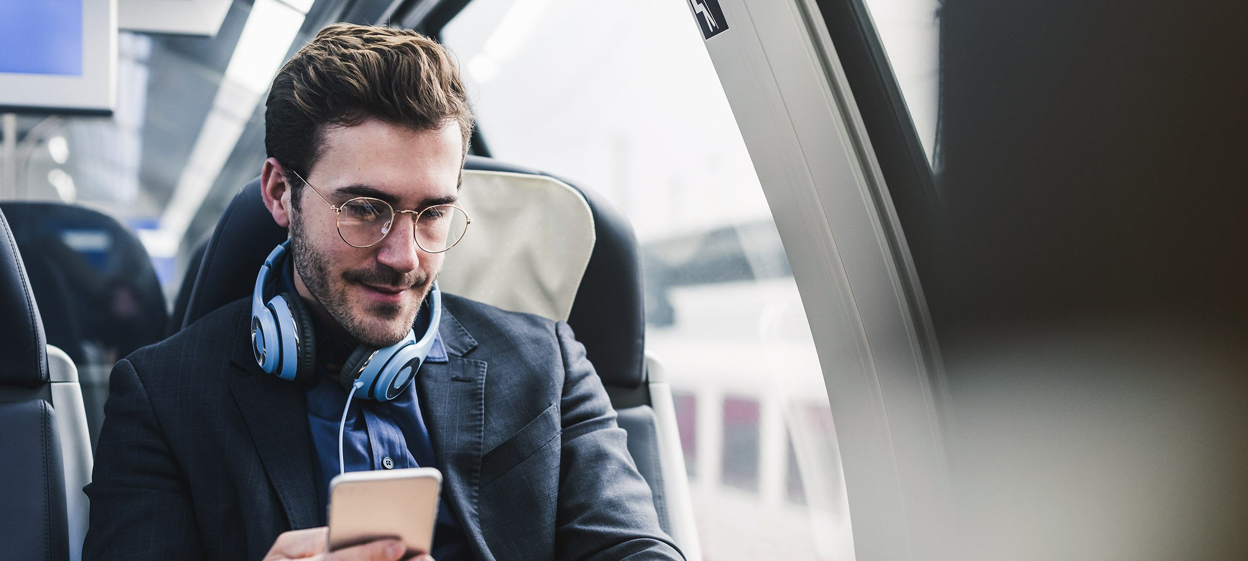 A man sits in a train